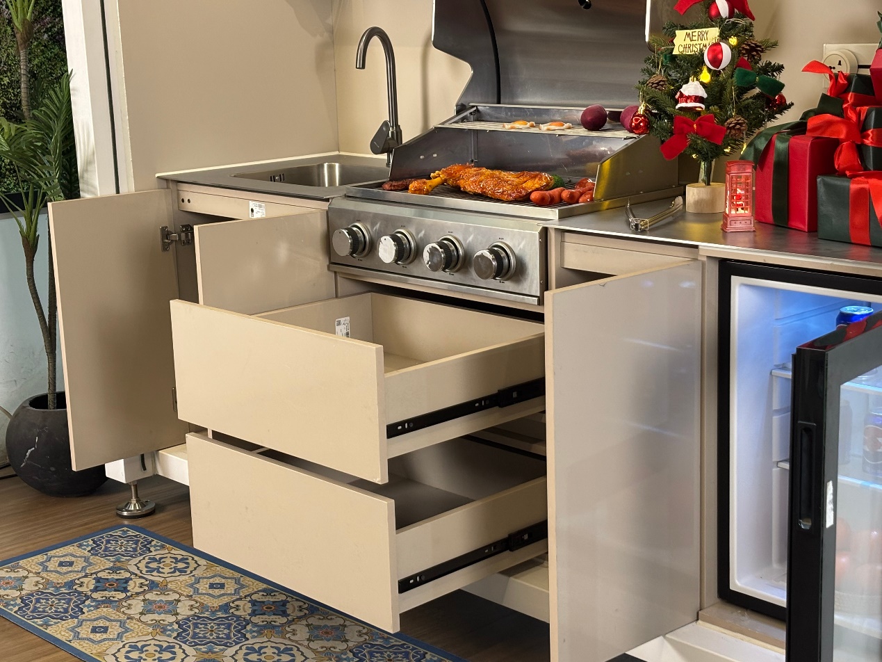 Weather-protected outdoor kitchen enclosure with a closable front