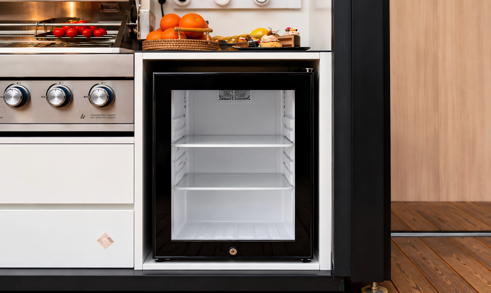 Outdoor kitchen with concealed drawers and dedicated appliance service zones