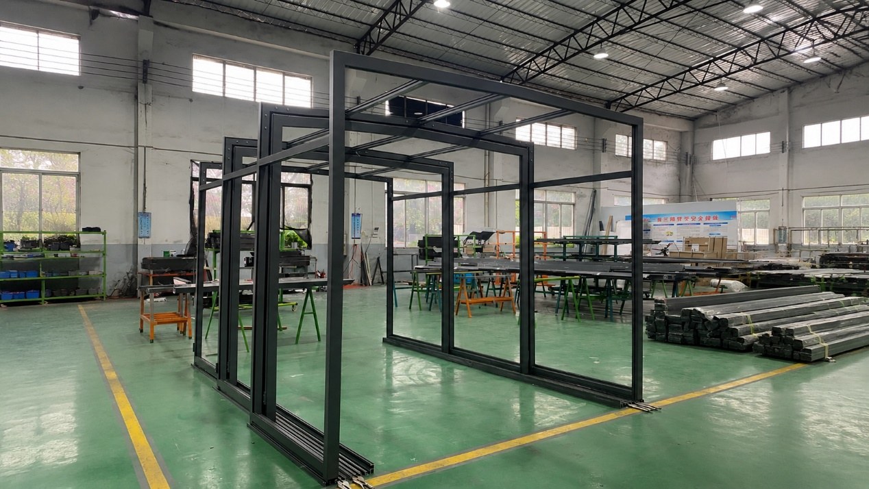 Factory assembly of retractable garage frames before delivery